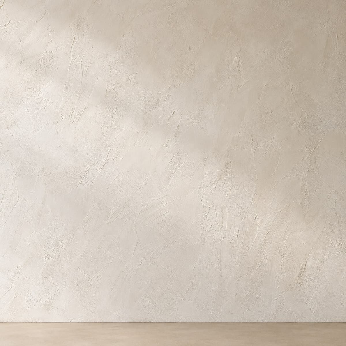 Detail van de minerale wandafwerking met fijne korrel